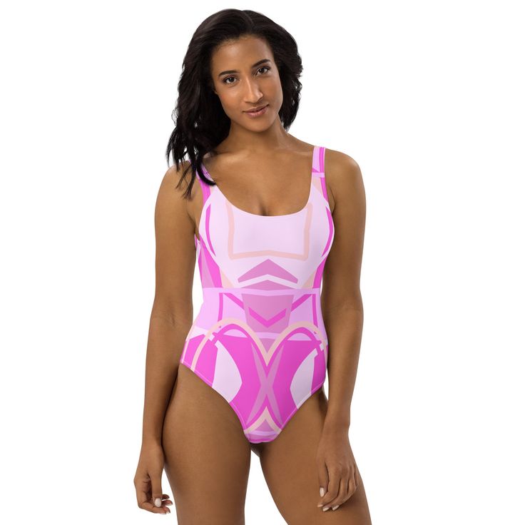 This one-piece swimsuit for all figures will bring out your best features. Enjoy the smooth fabric and the flattering design, and show it off by the sea or pool! * 82% Polyester, 18% Spandex * Fabric weight: 6.78 oz/yd² (230 g/m weight may vary by 5% * Chlorine-resistant fabric * Cheeky fit with a scoop neckline and a low scoop back * Zig-zag stitching * Double-layer front  * Four-way stretch material stretches and recovers on the cross and lengthwise grains This product is made especially for you as soon as you place an order, which is why it takes us a bit longer to deliver it to you. Making products on demand instead of in bulk helps reduce overproduction, so thank you for making thoughtful purchasing decisions! Fitted Pink Swimwear With Uv Protection, Fitted Swimwear For Sports In Summer, Pink Fitted Leotard For Swimming, Fitted Sports Swimwear For Summer, Fitted Pink Swim Dress For Poolside, Fitted Pink Leotard For Swimming, Pink Fitted Swimwear For The Pool, Pink Fitted Swimwear For Pool, Fitted Pink Swimwear For The Pool