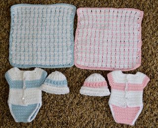 three crocheted baby items laid out on the floor