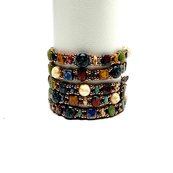 This bracelet pairs well with many of my other bracelets so it’s easy to stack and layer.  It also wears well alone. The shape is perfect for a smooth interior finish to the bracelet and comfortable wearing for you. The black half dome Czech glass beads are called candy beads.  How could I name the bracelet anything el Elegant Multicolor Stackable Beaded Bracelets, Elegant Multicolor Stackable Stretch Bracelet, Stackable Bangle Jewelry, Stacked Adjustable Beaded Bracelets, Adjustable Stacked Bangle Bracelets, Colorful Beaded Bangle, Elegant Multi-strand Bracelets With Colorful Beads, Stacked Bangle Bracelets As Gift, Elegant Adjustable Wrap Bracelet With Colorful Beads