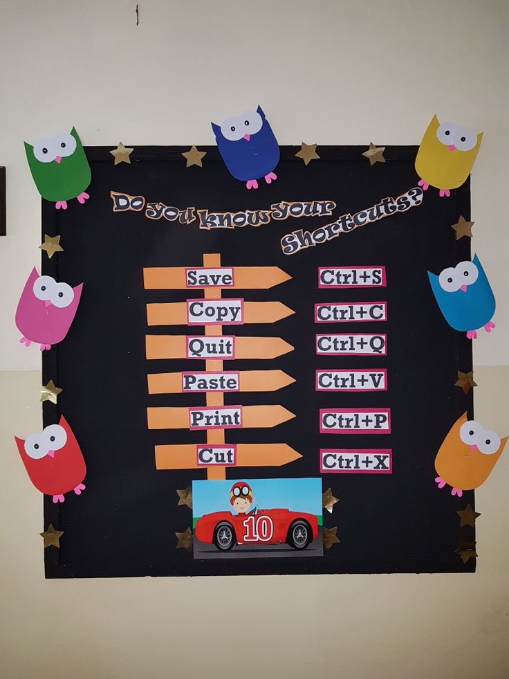 a bulletin board with owls, cars and stars in the shape of numbers on it