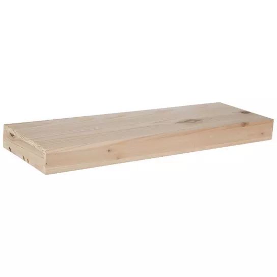 a wooden shelf sitting on top of a white wall in front of a white background