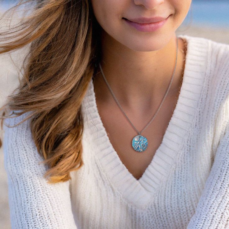 Immerse yourself in a world of playful refinement with our Into the Blue Necklace—a truly lovely adornment that effortlessly captures the mesmerizing essence of the wonders of the seas. This necklace isn't just jewelry; it's a wearable masterpiece, designed to evoke the allure of ocean depths and the enchanting mysteries found beneath the waves. Elevate your style with this captivating piece, a harmonious blend of playfulness and refined elegance. Dive into the world of ocean-inspired fashion an Personalized Ocean-inspired Jewelry Gift, Ocean-inspired Adjustable Charm Necklace Gift, Ocean-inspired Pendant Charm Necklace As Gift, Turquoise Aquamarine Round Necklace, Turquoise Aquamarine Necklace, Light Blue Ocean-inspired Jewelry For Gift, Light Blue Ocean-inspired Jewelry Gift, Ocean-inspired Light Blue Jewelry For Gift, Adjustable Blue Necklace For Her