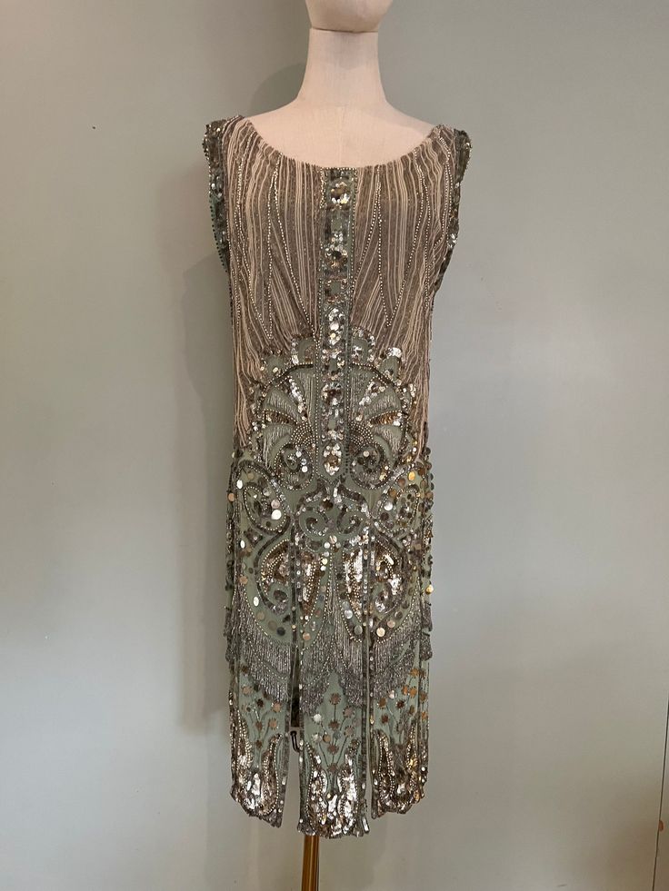 Sleeveless Gatsby Flapper Evening Dress, Sleeveless Gatsby Flapper Dress, Art Deco Sleeveless Flapper Dress For Evening, Sleeveless Gatsby Embellished Flapper Dress, Gatsby Style Sleeveless Embellished Flapper Dress, Sleeveless Sequined Flapper Dress For Wedding, Sleeveless Art Deco Flapper Dress For Evening, 1920s Sleeveless Evening Flapper Dress, Sleeveless Gatsby Dress With Beaded Fringe