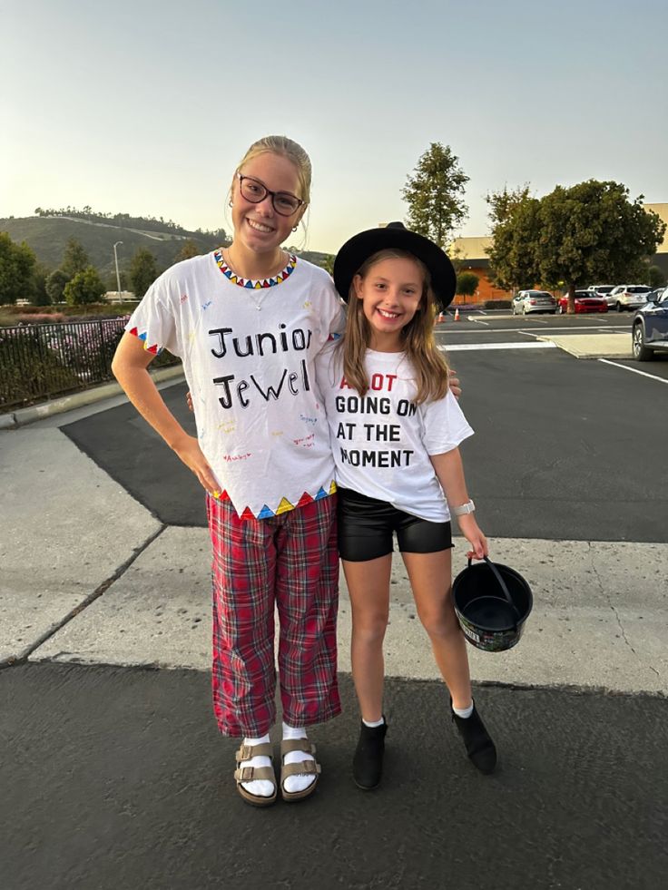 two people standing next to each other in the street