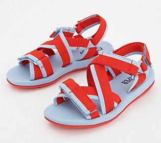 a pair of children's sandals with straps on the front and back, both in red and blue