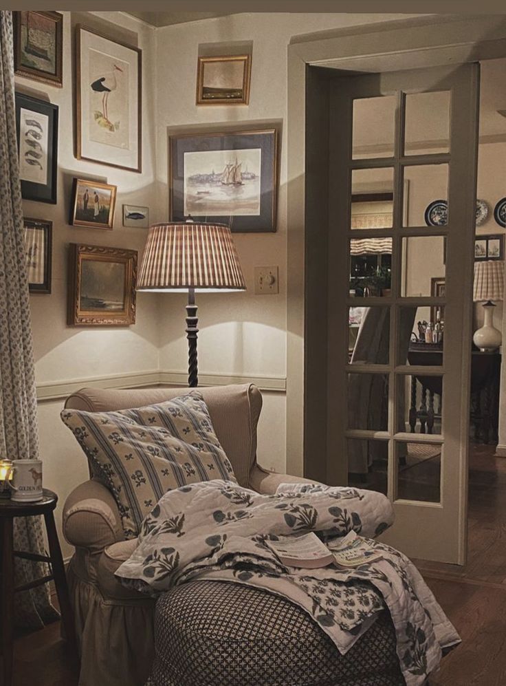 a living room filled with furniture and pictures on the wall