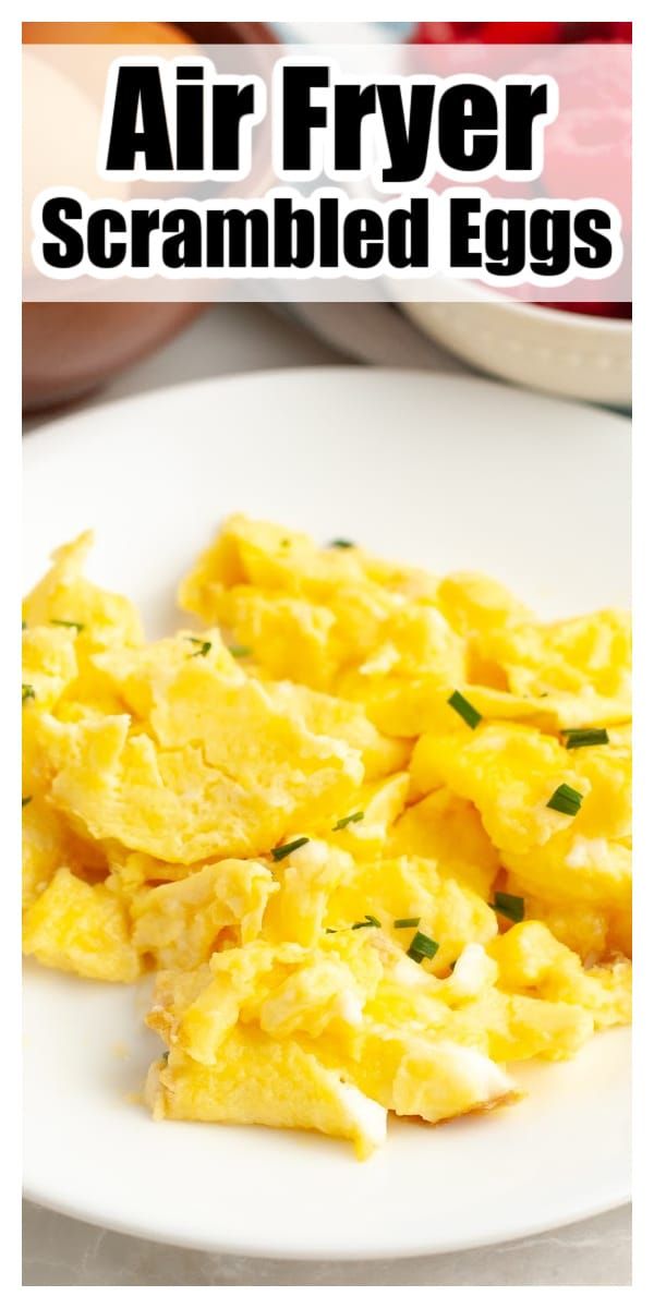 scrambled eggs on a white plate with text overlay that reads air fryer scrambled eggs