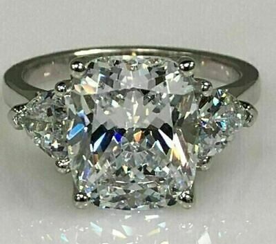 a cushion cut diamond ring with three side stones