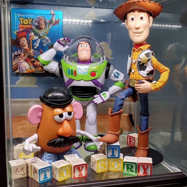 toy story figurines are displayed in a display case