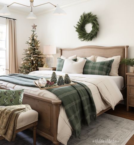 a bedroom decorated for christmas with green and white decor