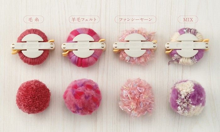 several different types of hair clips on a white surface with japanese characters in the background