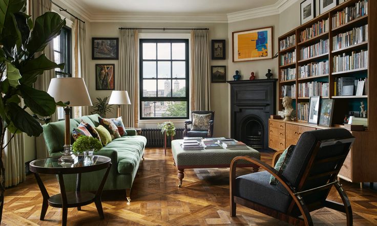 a living room filled with furniture and bookshelves