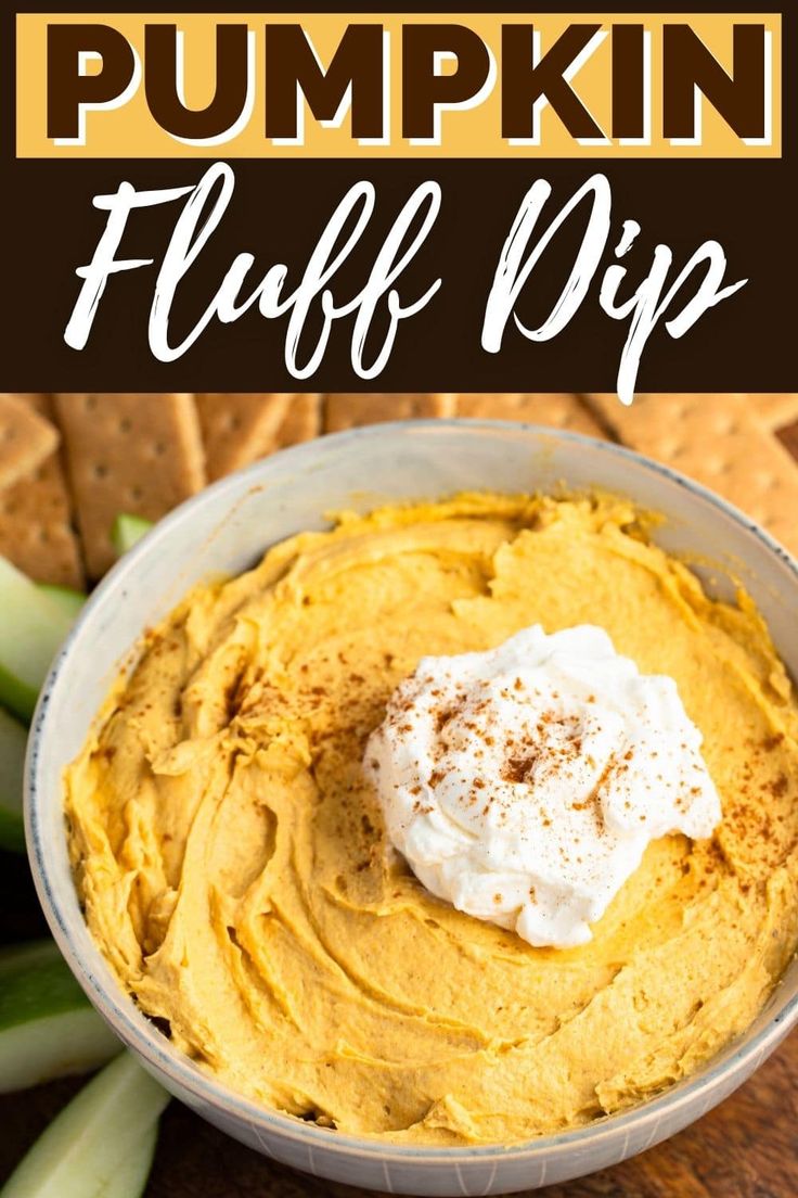 pumpkin fluff dip in a bowl with crackers and celery on the side