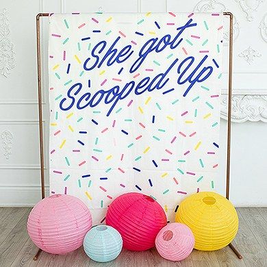 three balls of yarn sitting in front of a sign that says she got scooped up