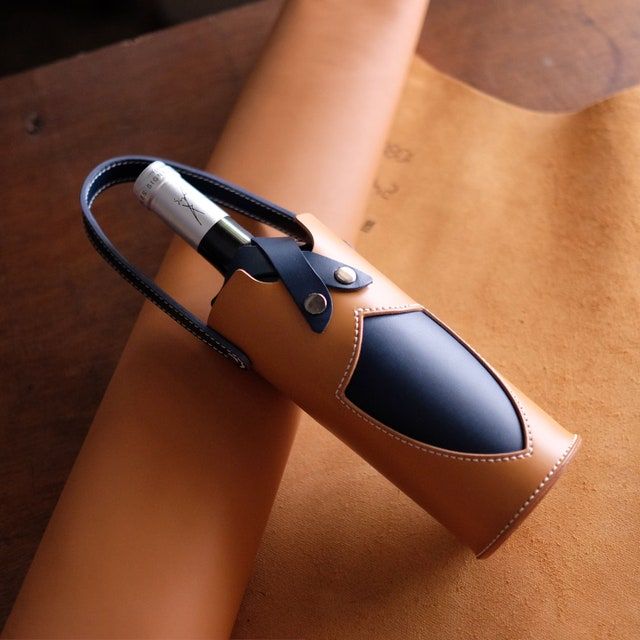 a leather case with a lighter in it