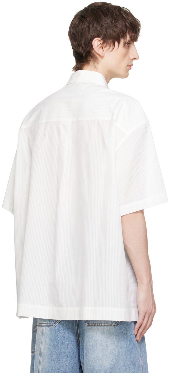 Semi-sheer cotton poplin shirt. Striped pattern throughout. · Spread collar · Button closure · Logo embroidered at patch pocket · Logo printed at front · Vented side seams · Box pleat at back yoke Supplier color: White Spring Shirt With Concealed Placket And Shirttail Hem, Cotton Tops With Concealed Placket For Daywear, Spring Shirt With Concealed Placket For Daywear, Spring Button-up Shirt With Concealed Placket, White Short Sleeve Shirt With Button Cuffs, White Shirt With Concealed Placket For Summer, Spring Cotton Blouse With Concealed Placket, White Tops With Concealed Placket And Relaxed Fit, Casual Shirt With Concealed Placket For Daywear