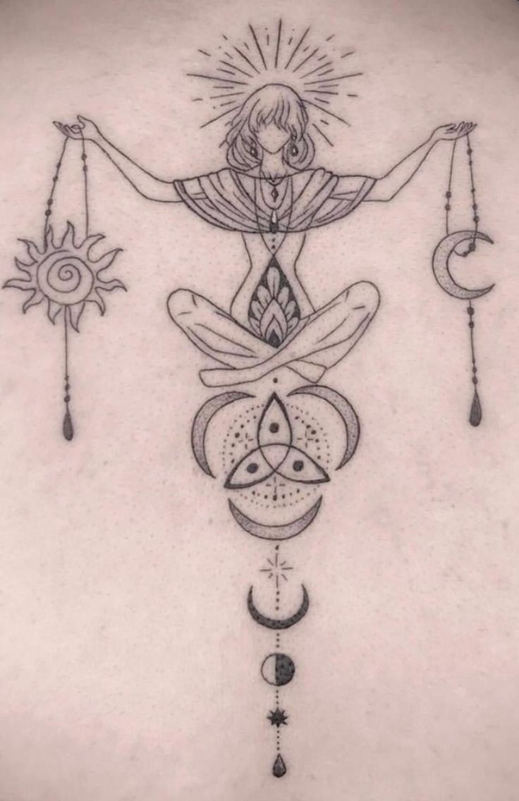 the back of a woman's stomach with an image of a person holding two sun and