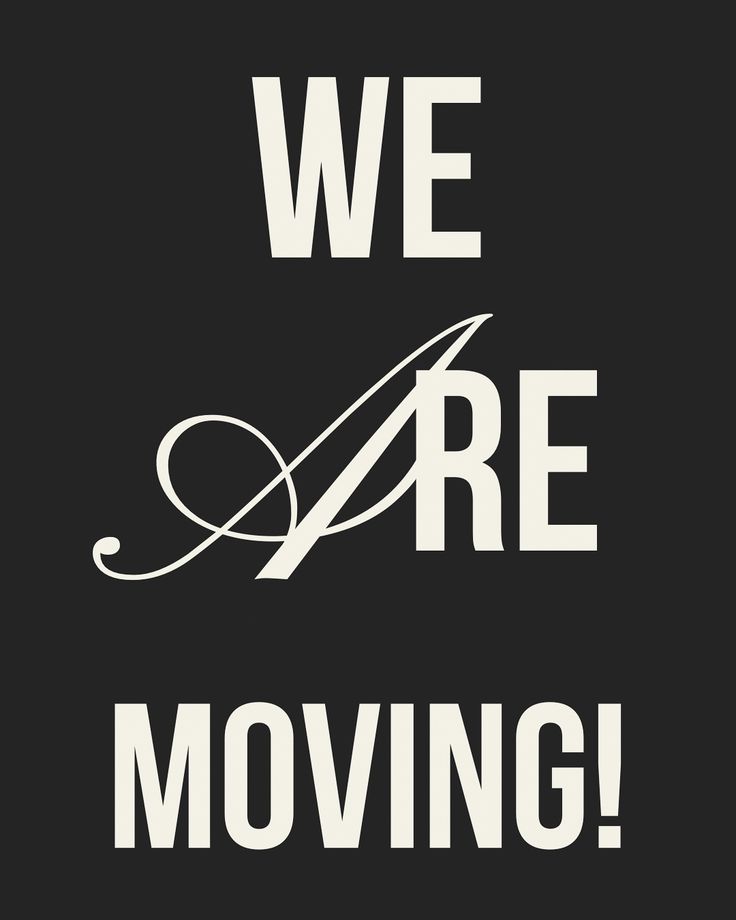 we are moving sign on black background with white lettering that reads, we are moving