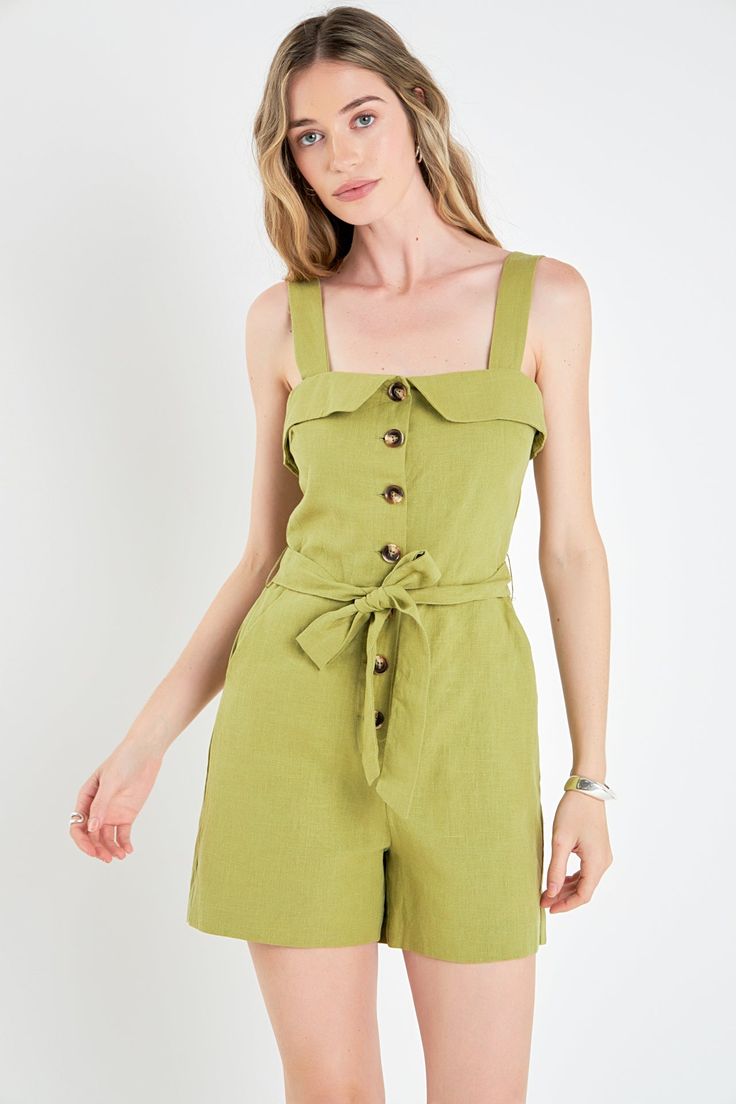 Make a sophisticated style statement in the Linen Romper with Self Tie and Buttons. Boasting a straight neckline shoulder straps front button closure and a matching tie belt this chic romper is designed to fit and flatter any silhouette. Crafted from breathable linen fabric it's perfect to wear all season long. Straight neckline Shoulder straps Front button down closure Tie belt Mini length Lined Pocket Hand wash cold Do not bleach Do not tumble dry Iton low Shell: 80% Linen 20% Cotton Lining: 1 Sleeveless Jumpsuits And Rompers With Tie Fastening For Spring, Chic Jumpsuits And Rompers With Adjustable Straps For Spring, Summer Workwear Jumpsuits And Rompers With Adjustable Straps, Chic Summer Jumpsuits And Rompers With Square Neck, Elegant Summer Jumpsuits And Rompers With Buttons, Green Buttoned Jumpsuits And Rompers, Chic Jumpsuits And Rompers For Vacation With Button Closure, Chic Vacation Jumpsuits And Rompers With Button Closure, Chic Belted Green Jumpsuits And Rompers