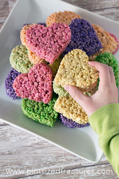 a white plate topped with heart shaped rice krispy treats