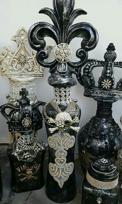 a group of black vases sitting next to each other