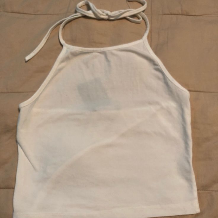 Brandy Melville White Halter Top White Halter Neck Top For Spring, Casual Fitted Cotton Halter Top, Casual Cotton Halter Top For Spring, Casual Cotton Halter Neck Crop Top, Stretch Cotton Halter Top For Day Out, Casual Halter Neck Top For Spring, Casual Fitted Halter Top For Day Out, Fitted Casual Halter Top For Day Out, White Cotton Halter Top Casual Style