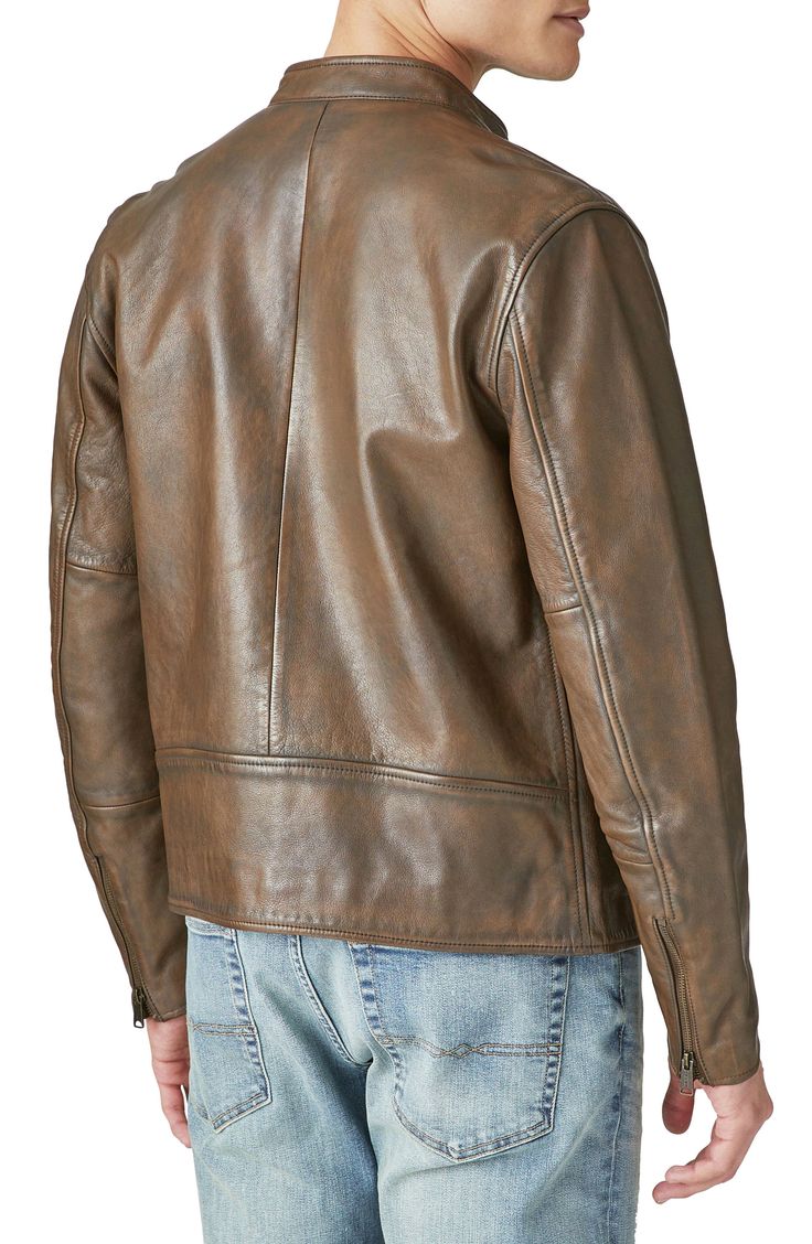 A weathered finish brings vintage character to a rugged leather jacket with plenty of zip pockets. Front zip closure Band collar with snap closure Zip cuffs Front and chest zip pockets Lined Leather Professional leather clean Imported Rugged Leather Jacket With Zipper Closure, Rugged Leather Outerwear With Zipper Closure, Rugged Leather Biker Jacket With Pockets, Brown Leather Jacket With Ykk Zipper, Rugged Biker Jacket With Double-needle Long Sleeves, Rugged Biker Jacket For Fall, Rugged Distressed Brown Leather Outerwear, Rugged Brown Outerwear With Zip Fly, Rugged Leather Biker Jacket