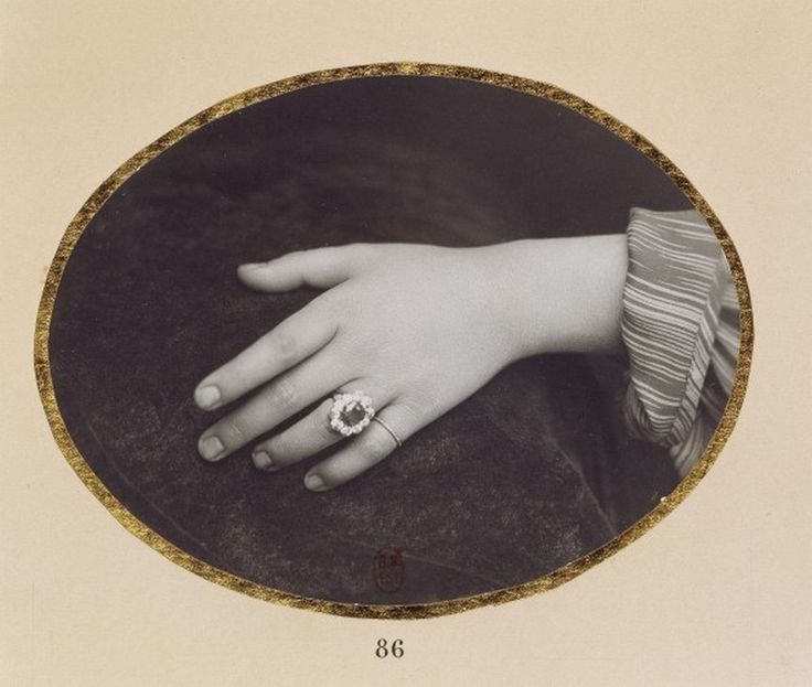 a woman's hand with a ring on it