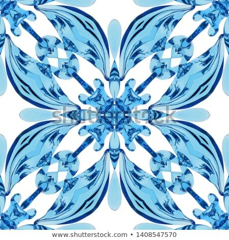 an abstract blue and white flower design