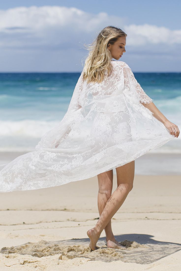 Welcome to the Suzi Rose designs shop Website: www.suzirose.com Instagram: suzi_rose_designs Design details - White lace kimono robe in a beautiful soft flowing french style lace. - Designed for a lose fit. Perfect for the bride to wear on the wedding day over a white slip (We also sell the slips separately) or perfect for any beach holiday or amazing piece to throw over an outfit for the festival seasons - Kimono comes with a white satin belt sash so you can close the robe around the waist - St Ethereal Beach Dress For Spring, Ethereal Spring Beach Dress, Bohemian Lace Cover-up For Party, Bohemian Lace Party Cover-up, Lace Beachwear Cover-up For Party, Lace Beachwear Dresses For Festival, Festival Beachwear Lace Dress, White Spring Party Cover-up, Bohemian Sheer Cover-up For Party