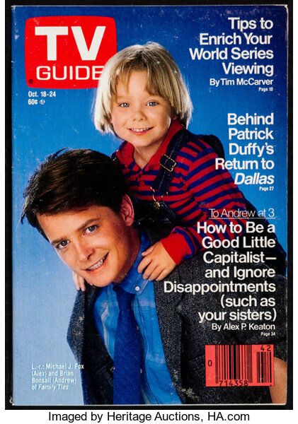 the cover of tv guide magazine with a young boy on his chest and an older man's head