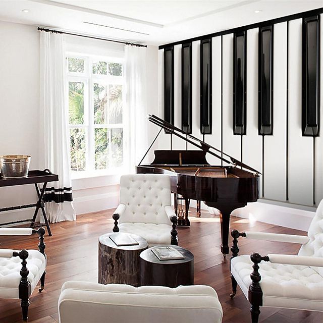 a living room filled with furniture and a piano in front of two large windows on top of a hard wood floor