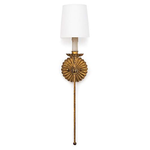 an antique brass wall light with a white shade on the top and bottom half of it