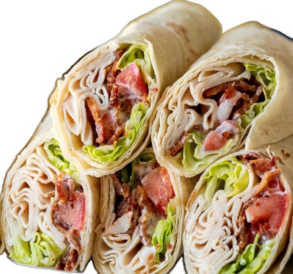 several wraps with meat, lettuce and tomato on them are stacked together to be eaten