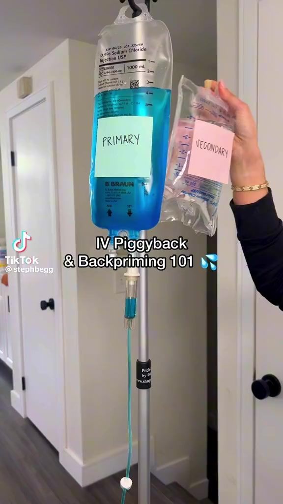 a person is holding up a plastic bag with an iv in it and the words primary on it