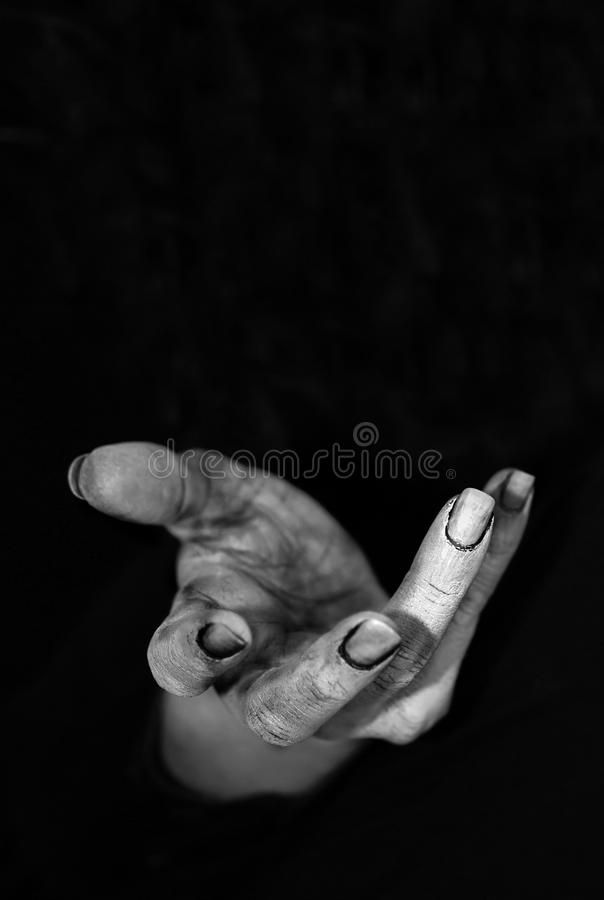 an old woman's hand making the vulcan sign with her fingers royalty images