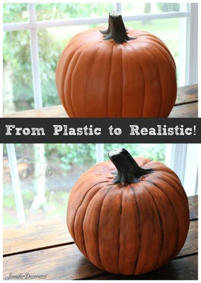 an orange pumpkin sitting on top of a wooden table next to a window with the words from plastic to realistic