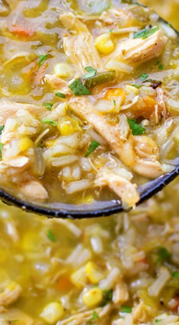 a spoon full of chicken and rice soup