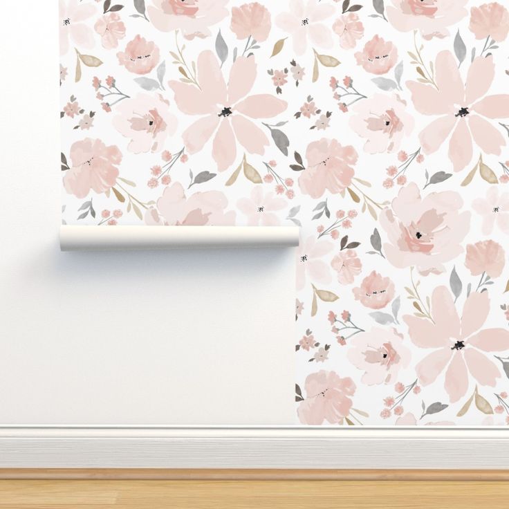 a white wall with pink flowers on it