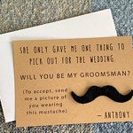 a piece of paper with a fake moustache on it next to an envelope