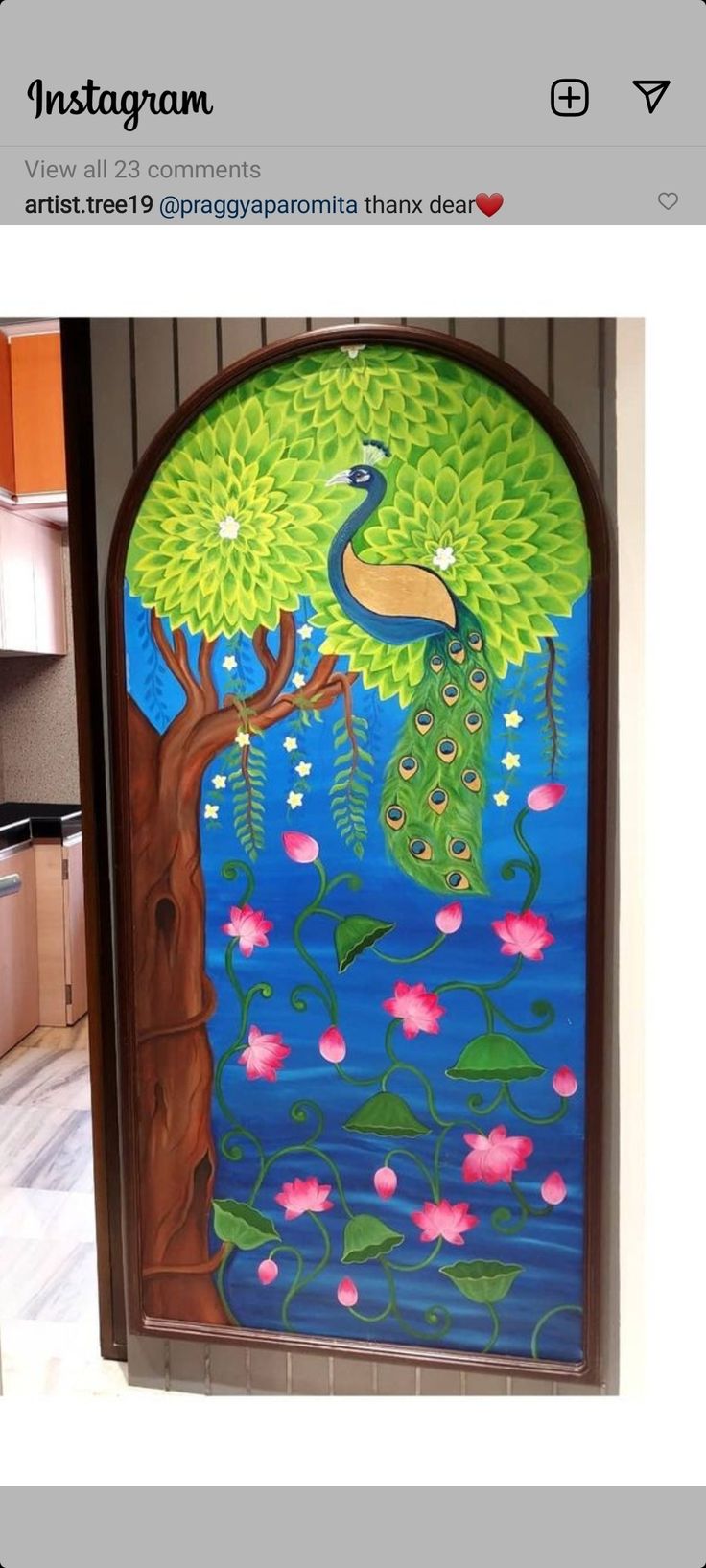 an image of a peacock painted on the side of a door