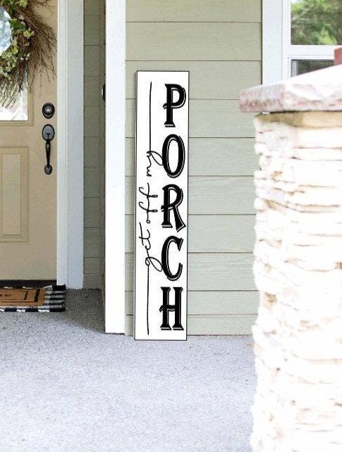 a porch sign on the front door of a house