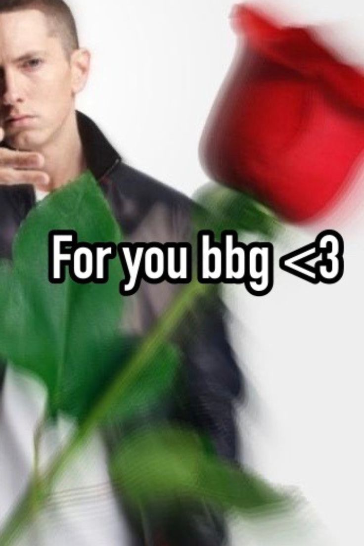 a man holding a red rose with the words for you big 3 on it in front of him