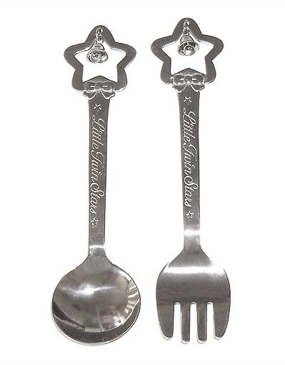 two silver spoons and fork with stars on them