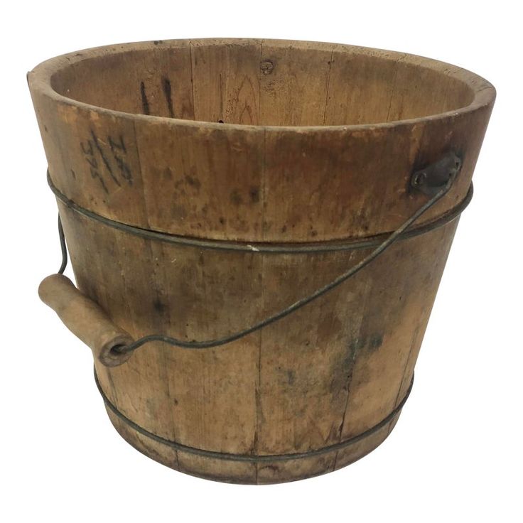 an old wooden bucket with metal handles