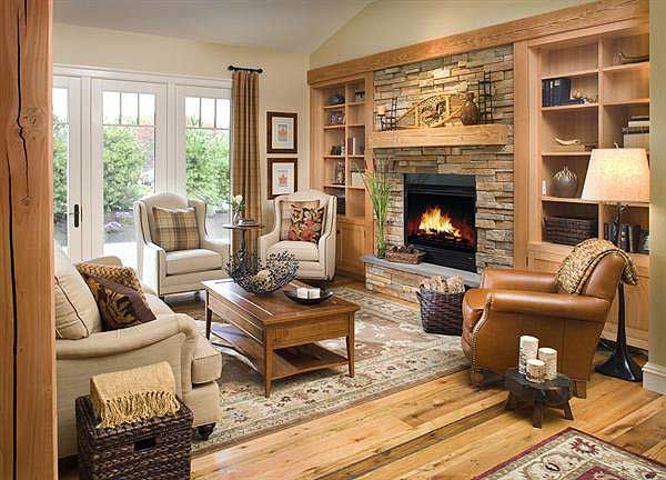 a living room filled with furniture and a fire place in the middle of a room