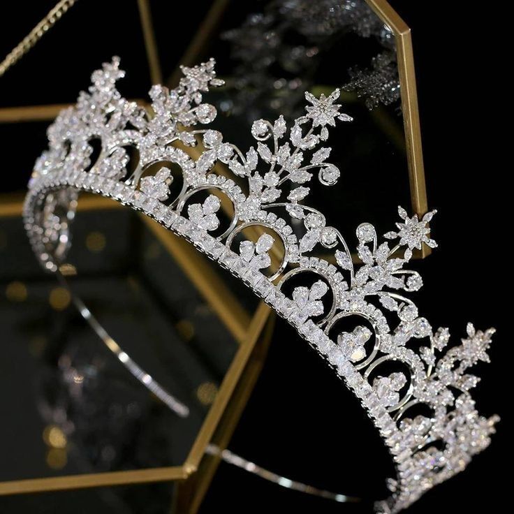 a tiara is shown in front of a mirror