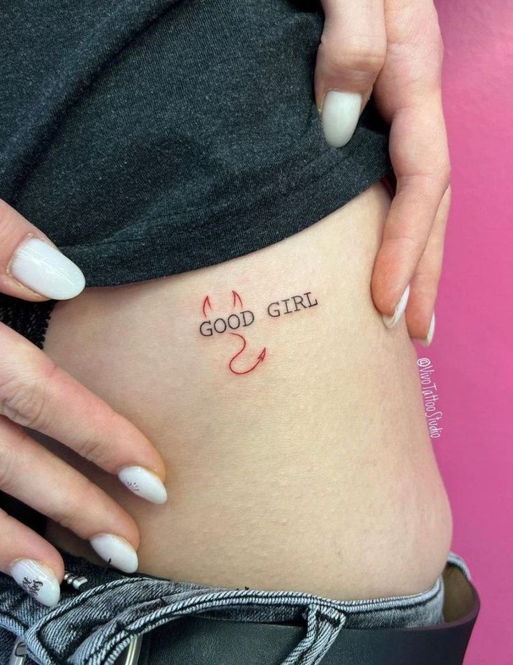 a woman's stomach with the words good girl on it