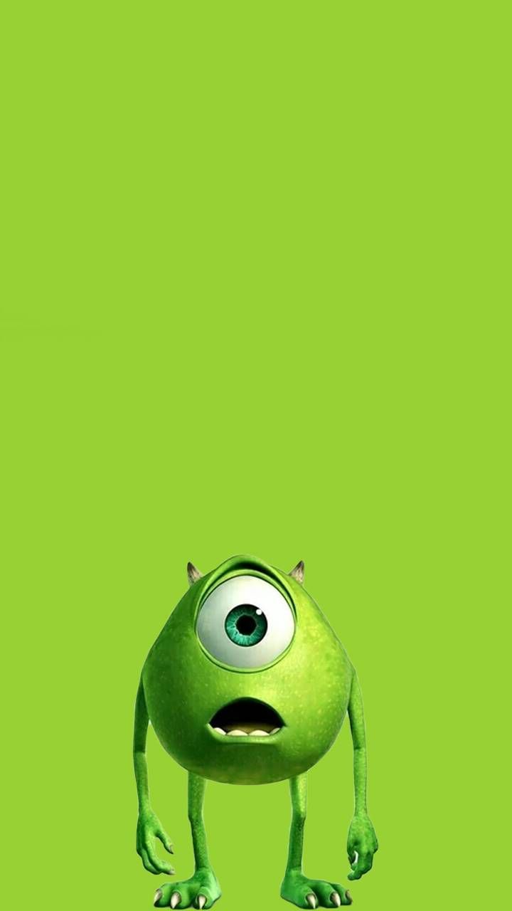 the character from monsters is standing in front of a green background