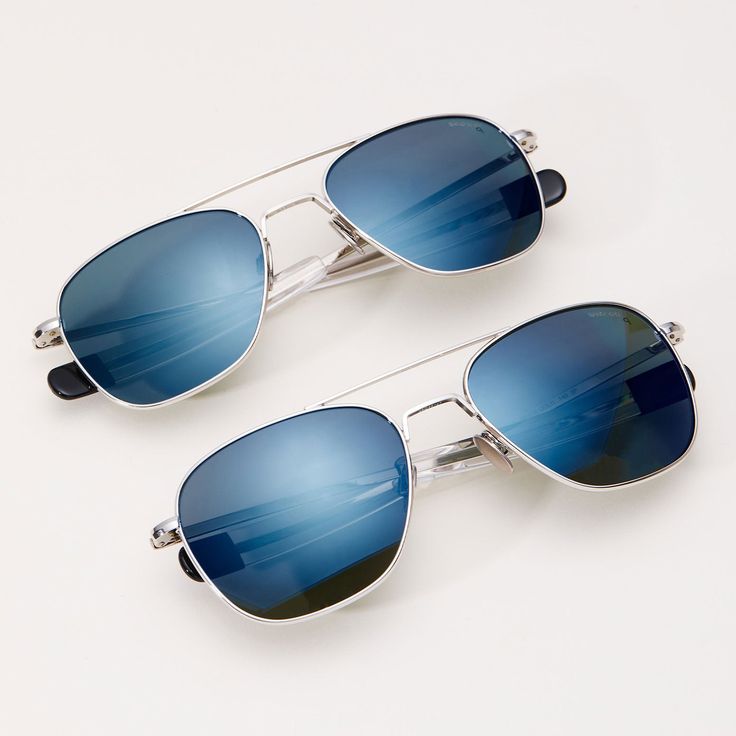 The Aviator, our top-selling icon style, in 23k White Gold with premium polarized Cobalt blue mirrored glass lenses. Now available in XL. Details include titanium nose pads and black tipped temples with 1973 logo. Engineered to military specs, designed and handcrafted in the USA. Casual Blue Aviator Sunglasses, Classic Blue Aviator Sunglasses With Uv Protection, Casual Blue Aviator Sunglasses With Anti-reflective Coating, Blue Aviator Sunglasses, Randolph Sunglasses, Blue Aviator Sunglasses With Anti-reflective Coating For Outdoor, Gold Aviator Sunglasses, The Aviator, Icon Style